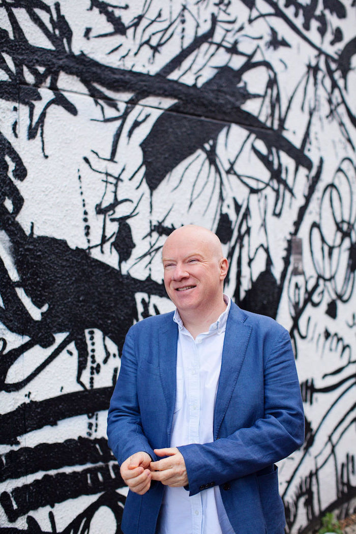 John Williams The Ideas Lab Profile Photo Graffiti Wall Blue Suit Saskia Nelson Hey Saturday.jpeg